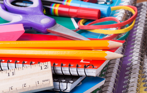 school supplies like notebooks, pencils, and rulers