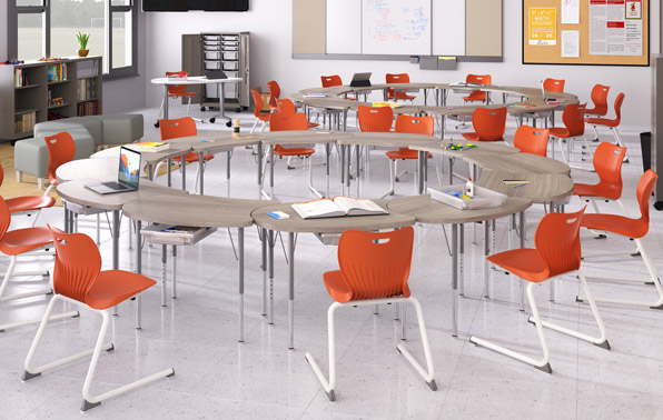 a classroom with desks arranged in circular groups